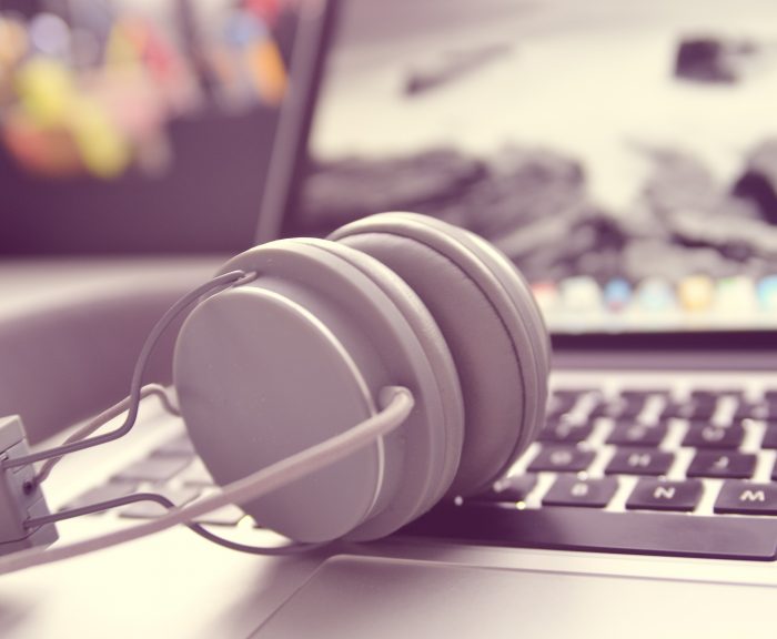 Headphones resting on a keyboard